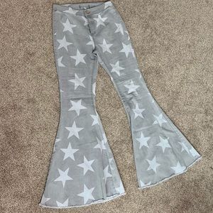 Star patterned bell bottom jeans
